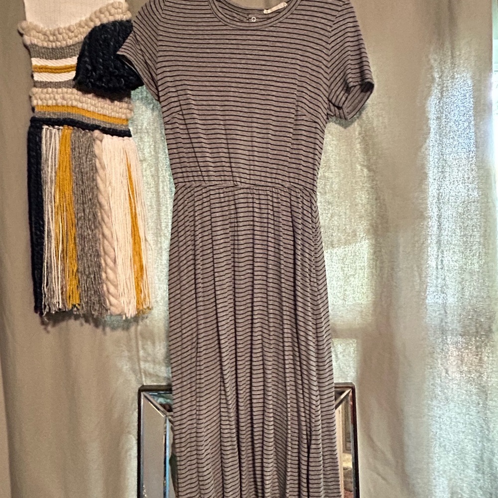 Cute summer dress with button up open back. Cute with tennis shoes. With pockets